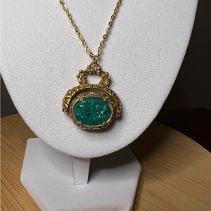 1960s vintage spinner pendant necklace Fleur de Lis faux jade